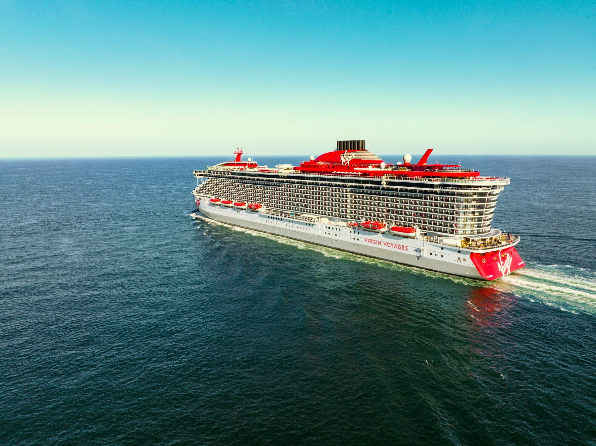 Virgin Voyages ship at sunset